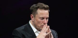 Man in suit deep in thought.