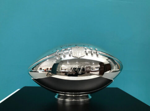 Silver NFL MVP trophy on display.