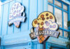 Ben & Jerry's ice cream shop with logo signs.