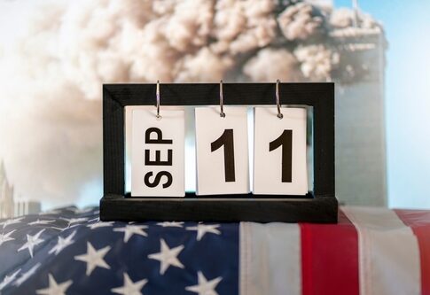 Calendar showing September 11 with American flag background.