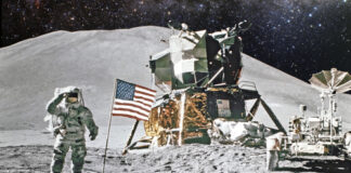 Astronaut saluting by American flag on the moon.