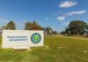 Federal Aviation Administration sign on spacious, grassy lawn.