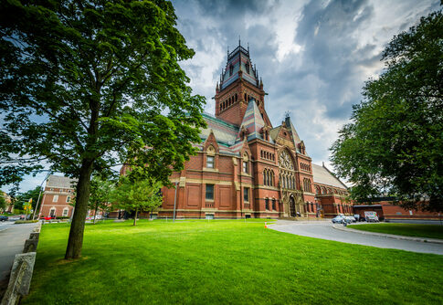 Red-brick, Gothic-style building with a prominent tower.