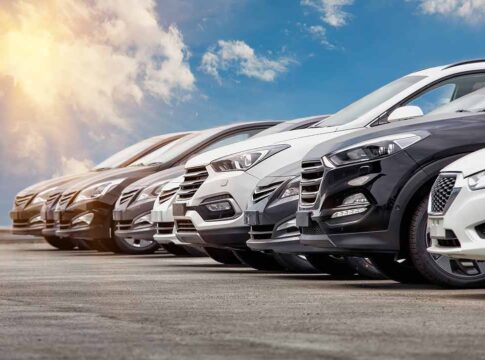 Row of parked cars in a lot.