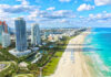 Aerial view of Miami Beach coastline and skyscrapers.