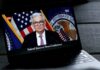 Federal Reserve Chairman speaking at a news conference, televised.