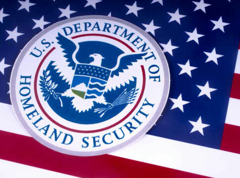 US Homeland Security emblem over American flag