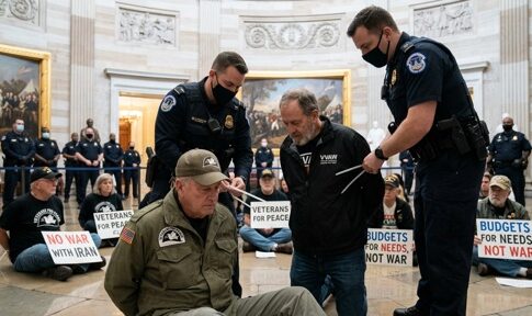 Veterans being arrested during a protest in the Capitol building