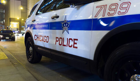 Chicago Police vehicle parked on city street at night.