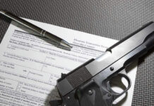 Prosecutor REFUSES NEW Assault Weapons BAN – Chaos in Virginia…. Form with gun and pen on table.